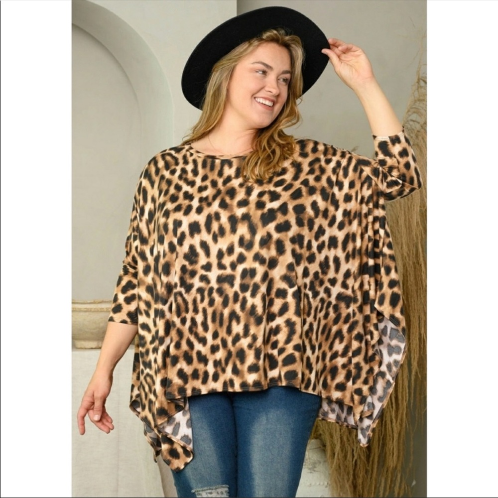 NWT PLUS SIZE (2X/3X) animal print asymmetrical top. VERY FLATTERING!!